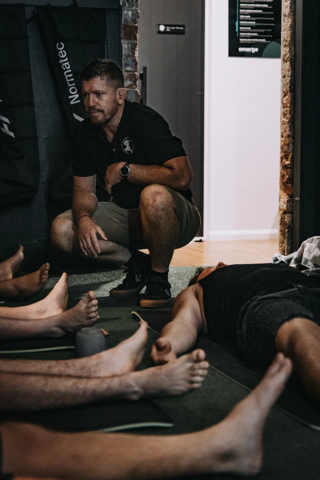 Brandt guiding men through an embodied training session